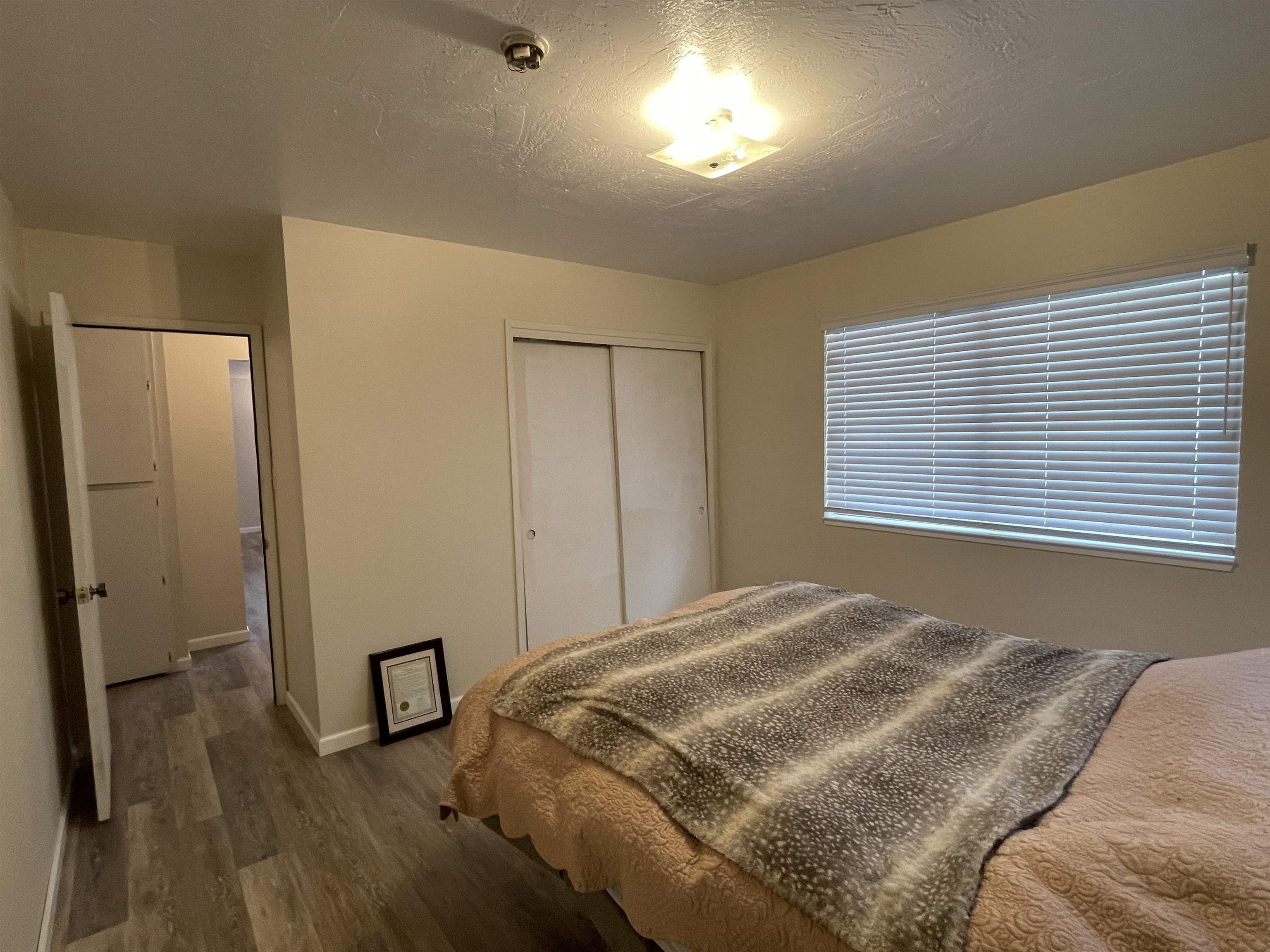 302 Mountain View Road Calpine, CA 96124 - Photo 18 of 26 a bedroom with a bed and a window