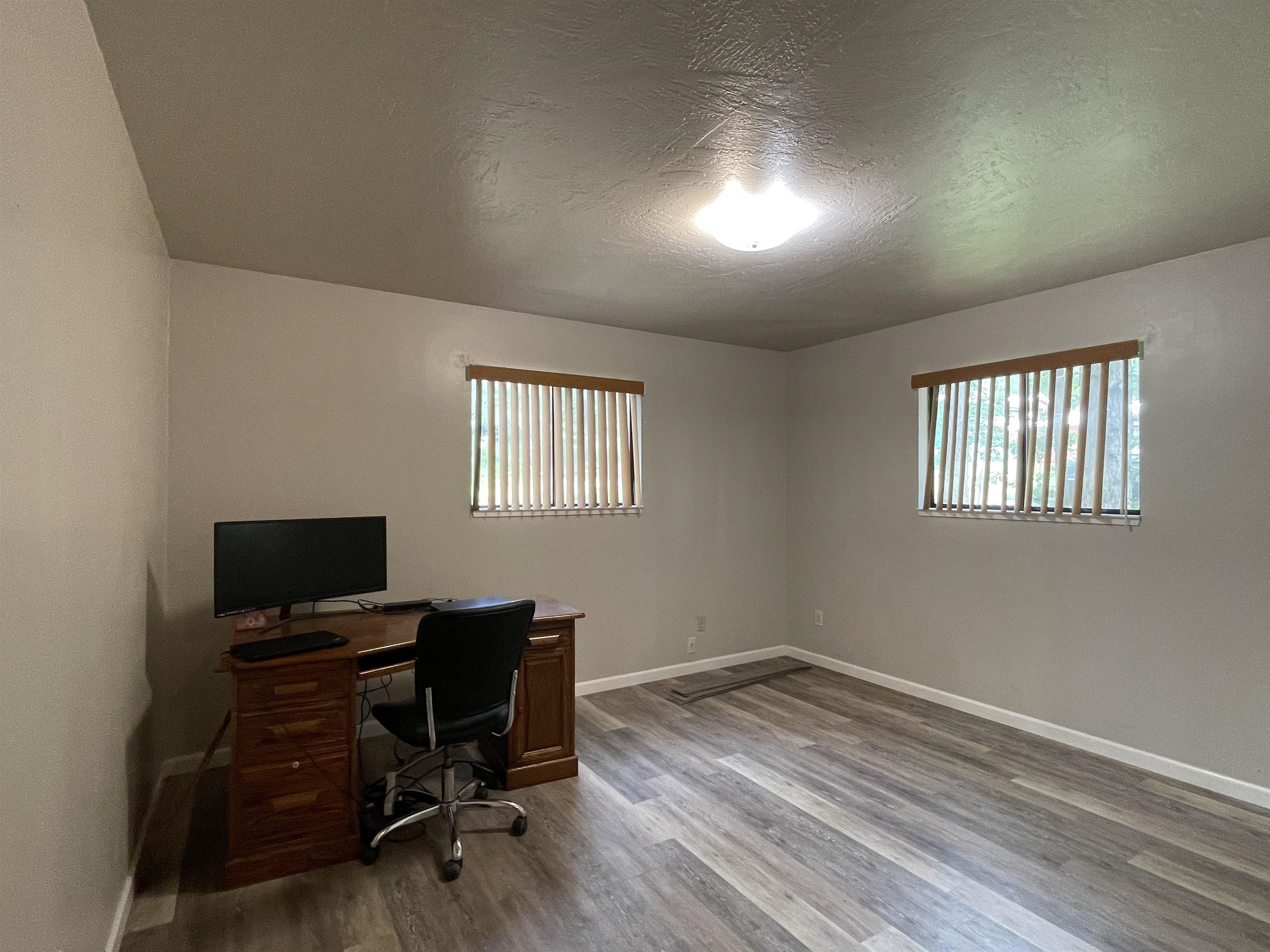 302 Mountain View Road Calpine, CA 96124 - Photo 19 of 26 a view of a workspace with furniture and a window
