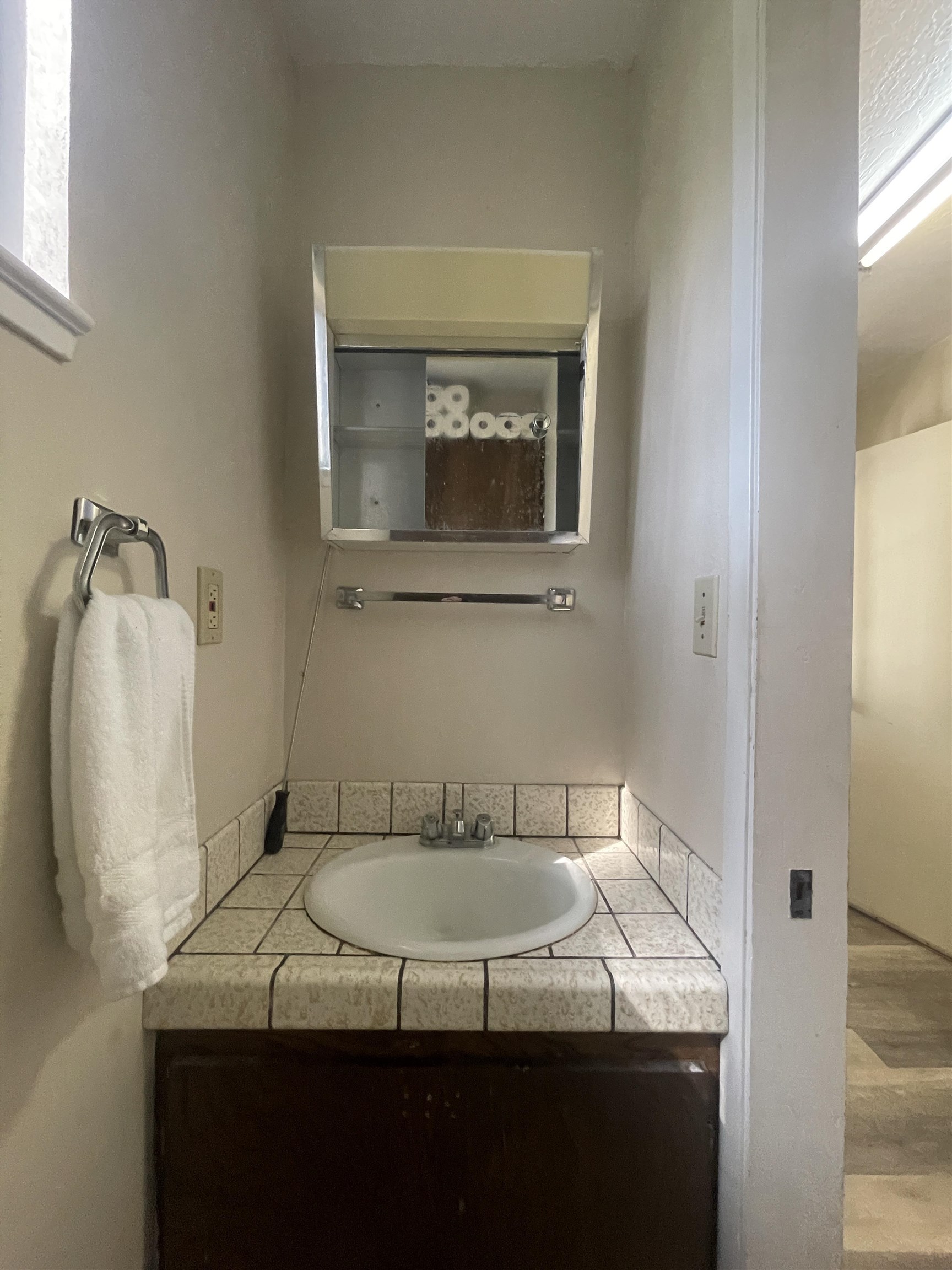 302 Mountain View Road Calpine, CA 96124 - Photo 20 of 26 a bathroom with a granite countertop sink and a mirror