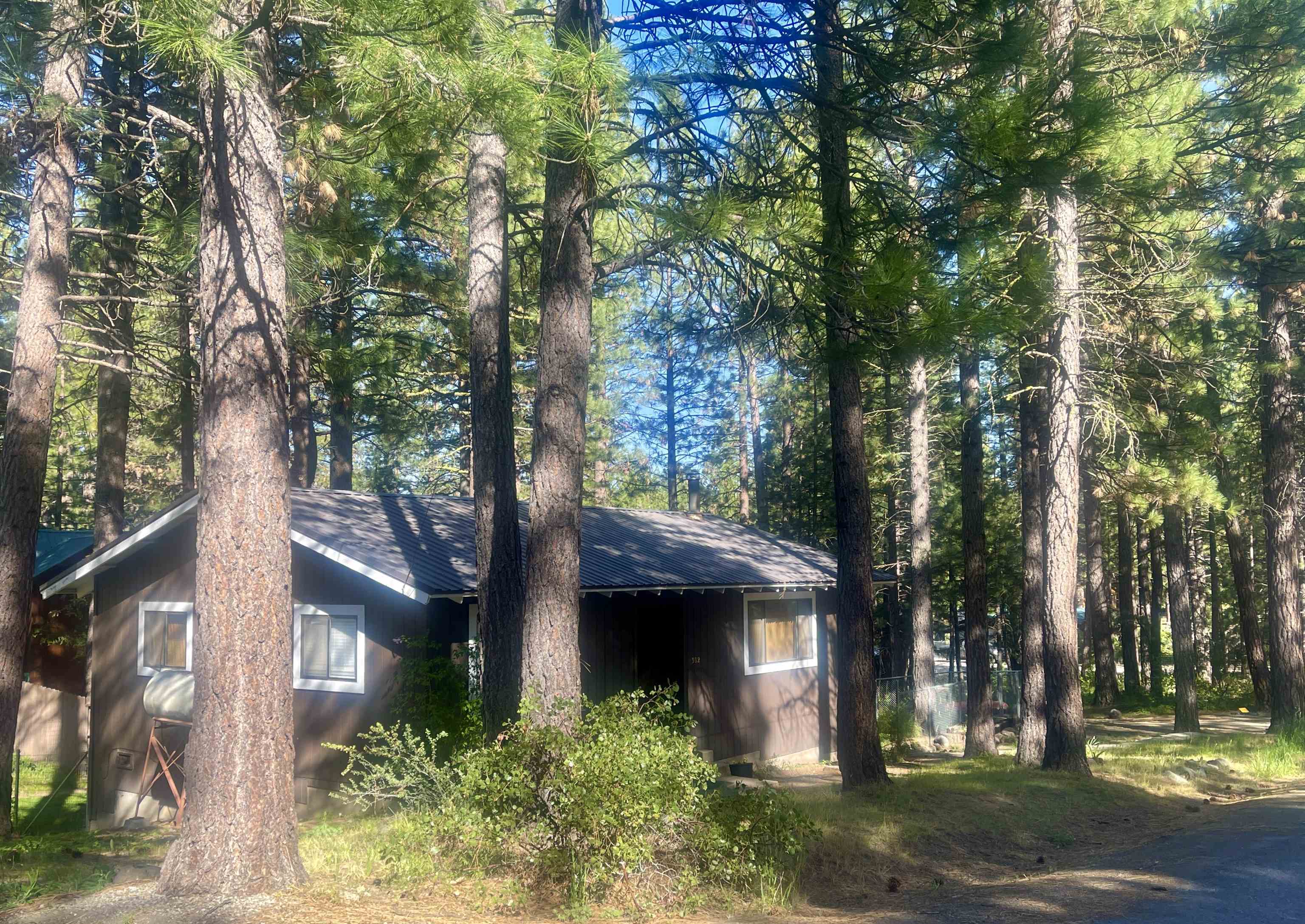 302 Mountain View Road Calpine, CA 96124 - Photo 25 of 26 a front view of a house with a garden