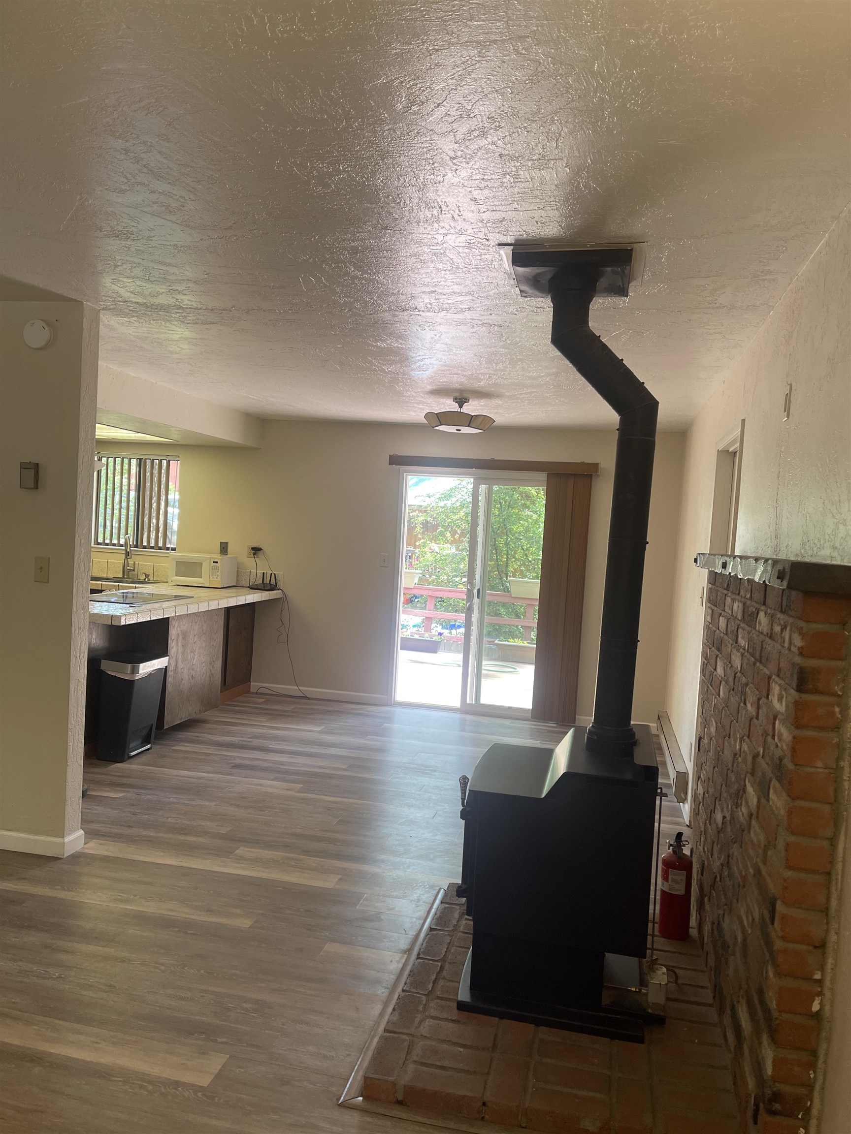 302 Mountain View Road Calpine, CA 96124 - Photo 7 of 26 a living room with furniture and a large window