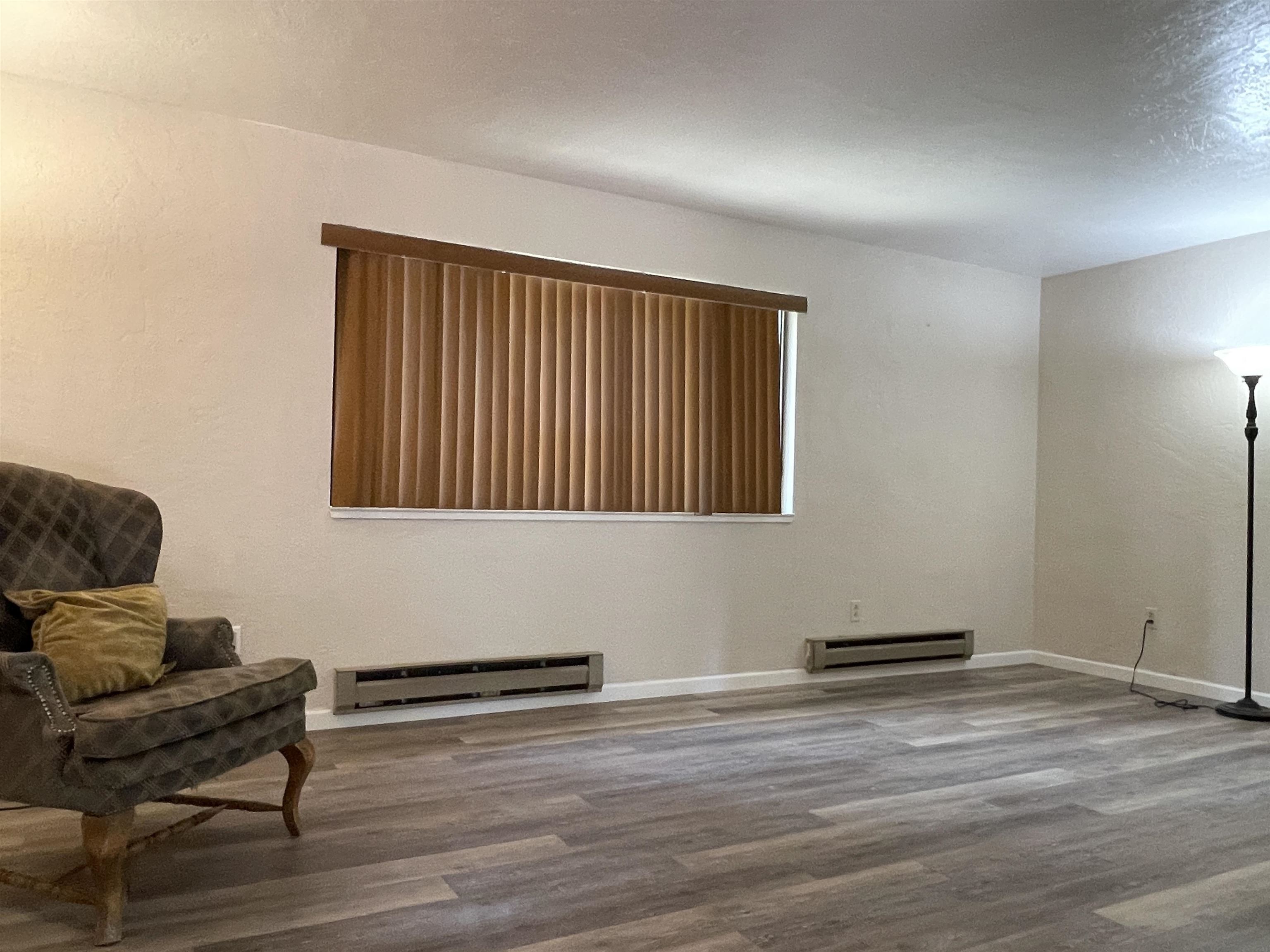 302 Mountain View Road Calpine, CA 96124 - Photo 9 of 26 a room with furniture and a wooden floor