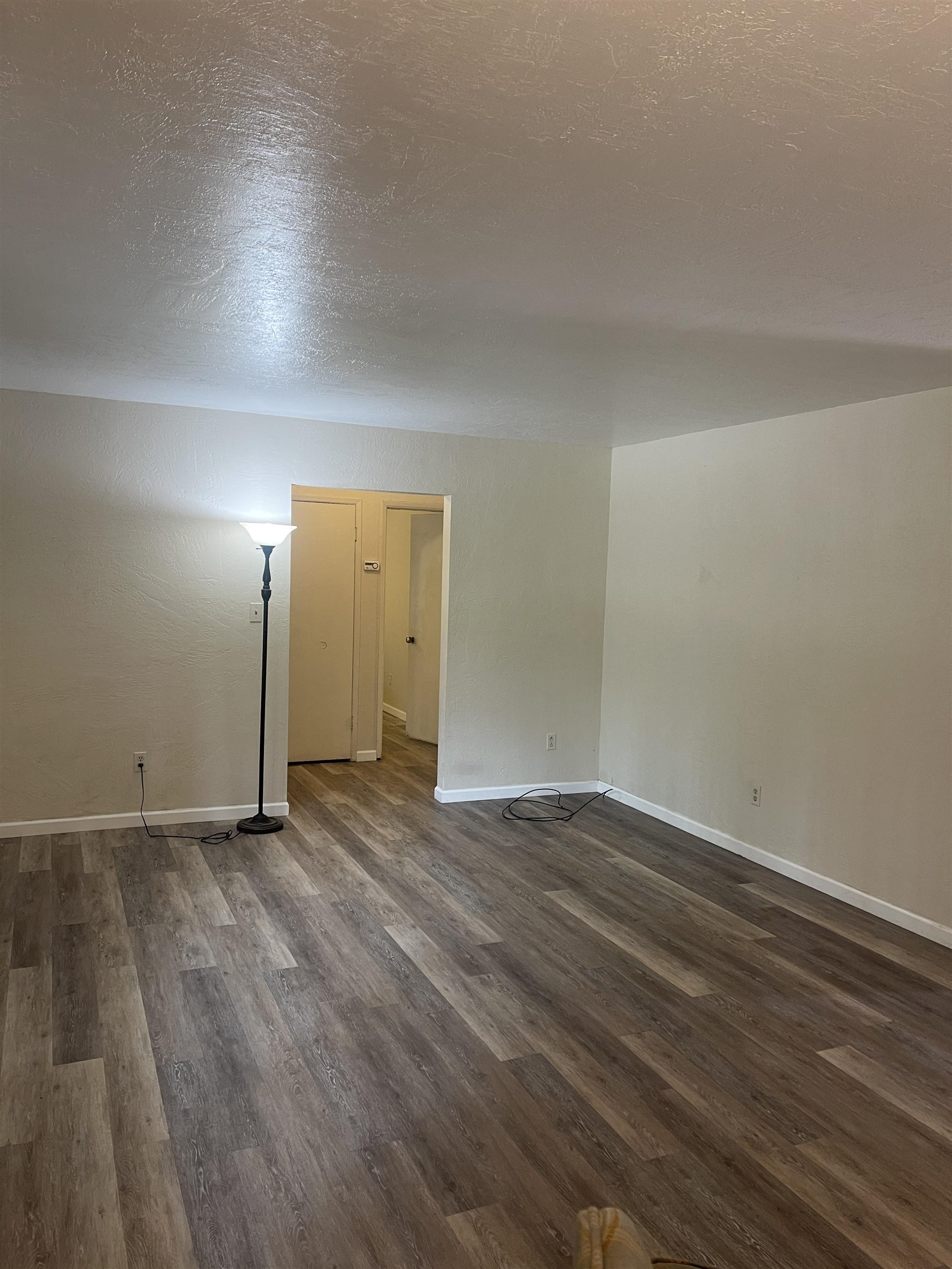 302 Mountain View Road Calpine, CA 96124 - Photo 10 of 26 a view of an empty room and wooden floor