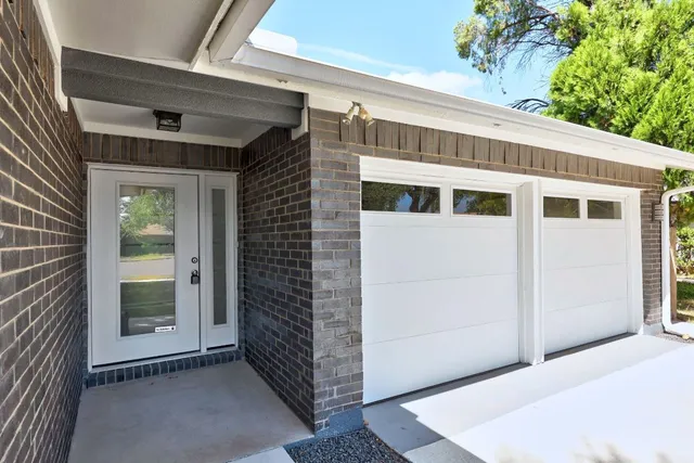 a front view of a house with a garage