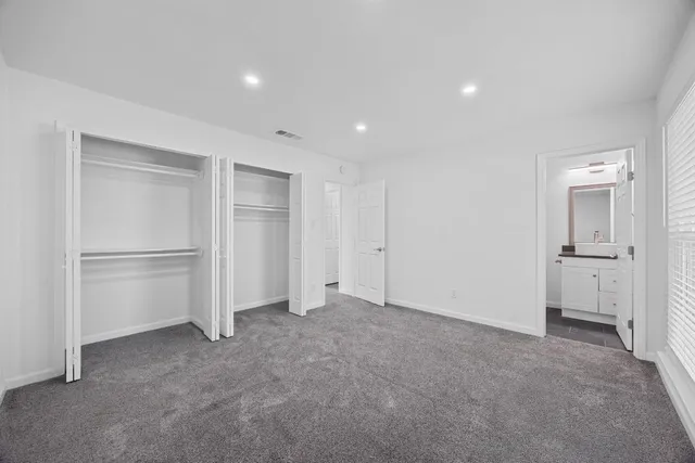 a view of an empty room and closet area