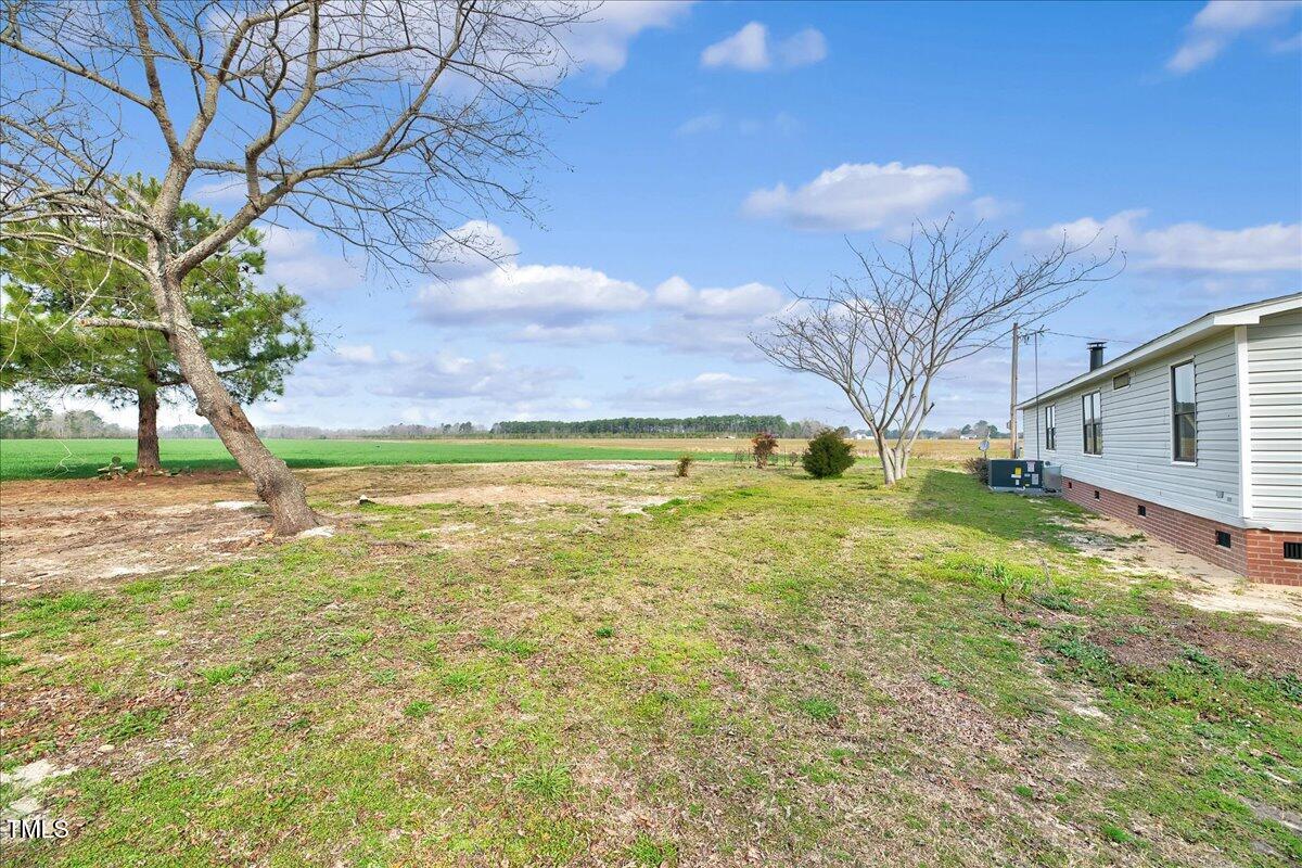10942 Simms Road Bailey, NC 27807 - Photo 37 of 44 a view of a house with a yard