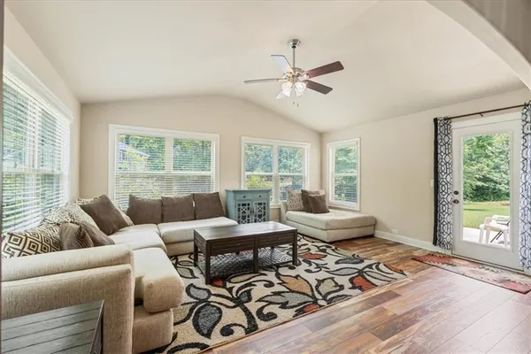 a living room with furniture and a window