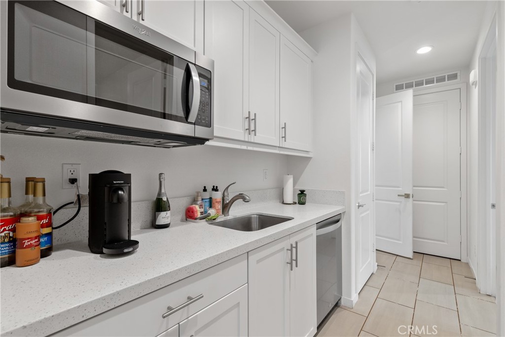 28341 Heather Grn Way Menifee, CA 92584 - Photo 28 of 44 Kitchenette with refrigerator and microwave in the Casita