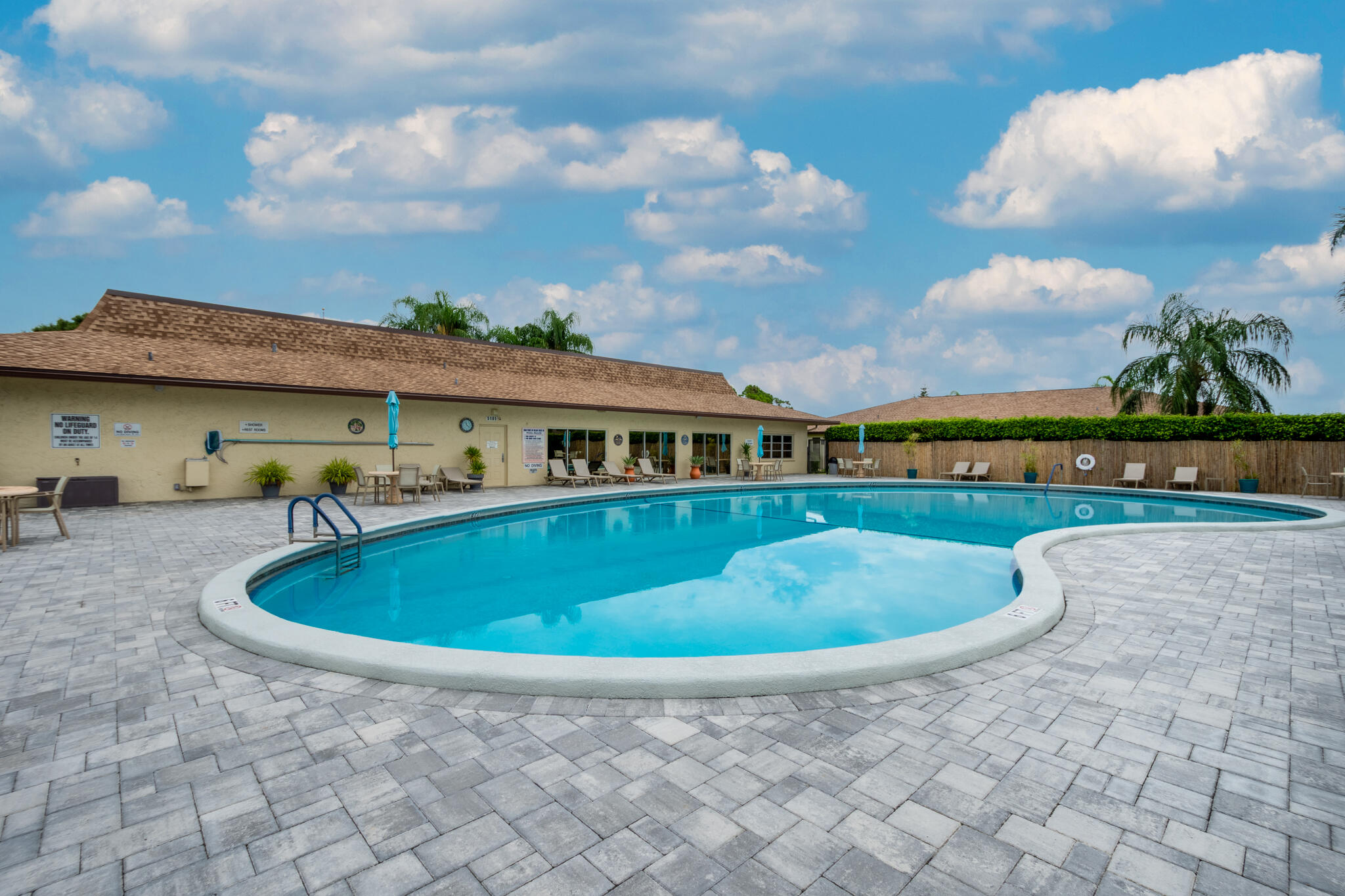 13960 Nesting Way, Unit C Delray Beach, FL 33484 - Photo 27 of 30 a view of outdoor space yard and swimming pool