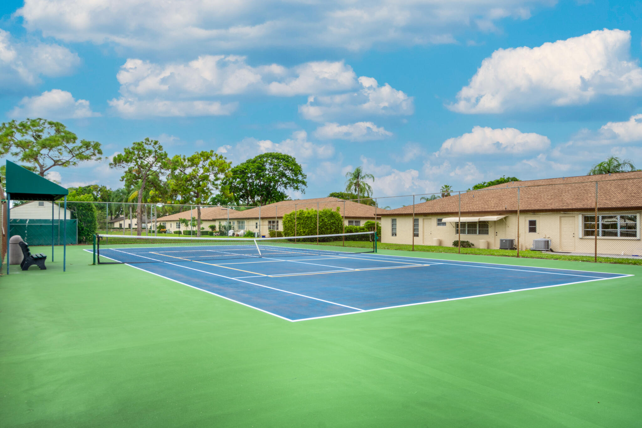 13960 Nesting Way, Unit C Delray Beach, FL 33484 - Photo 28 of 30 a view of building with outdoor space