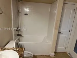 a bathroom with a sink and a shower