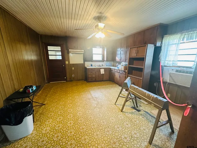 a bed room with a bed furniture and a chandelier