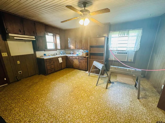 a bedroom with a bed furniture and a window