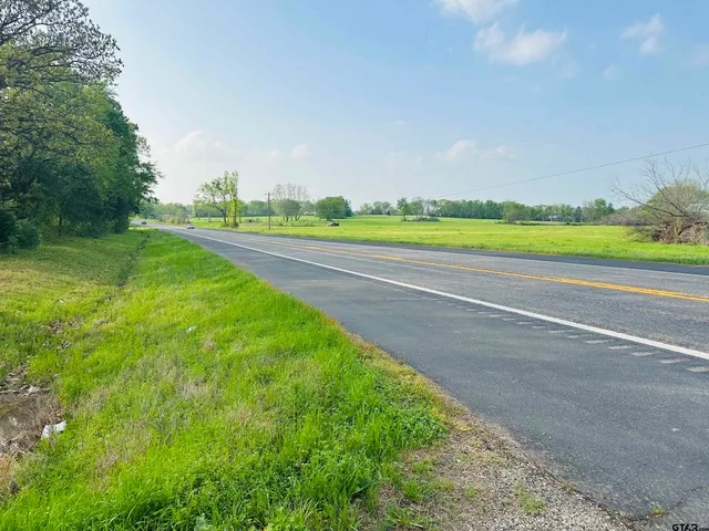 a view of a golf course with green space