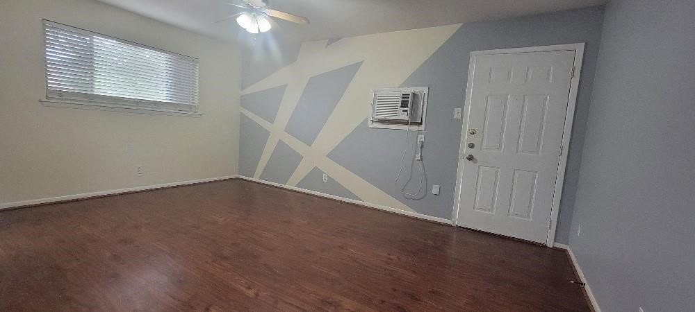 1806 West Main Street, Unit 5 Houston, TX 77098 - Photo 4 of 8 an empty room with windows