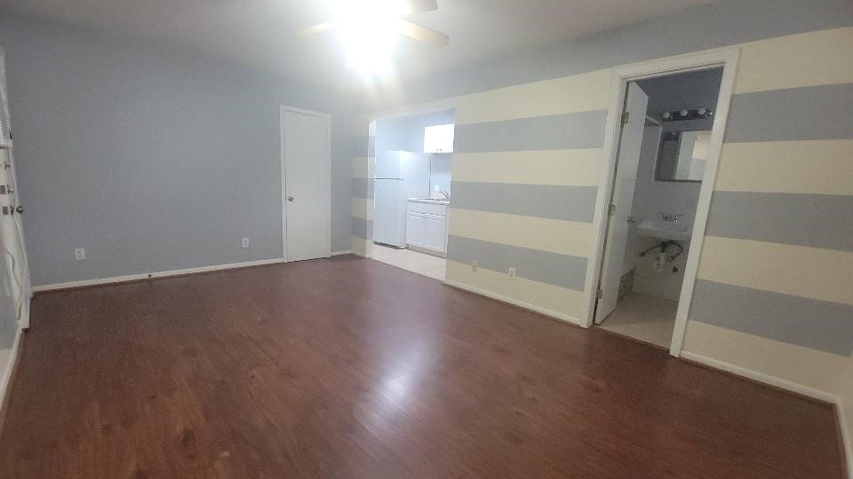 1806 West Main Street, Unit 5 Houston, TX 77098 - Photo 5 of 8 wooden floor in an empty room