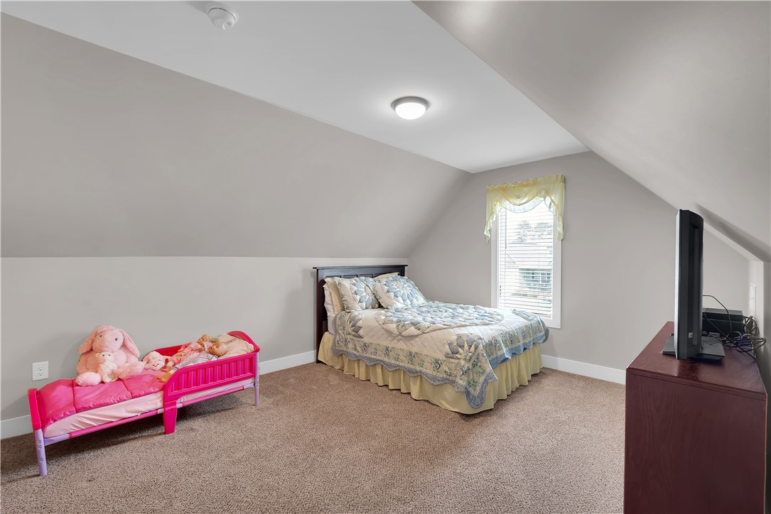 181 Amberwood Drive Anderson, SC 29621 - Photo 22 of 28 This cozy bedroom features a unique sloped ceiling and window for ample natural light.