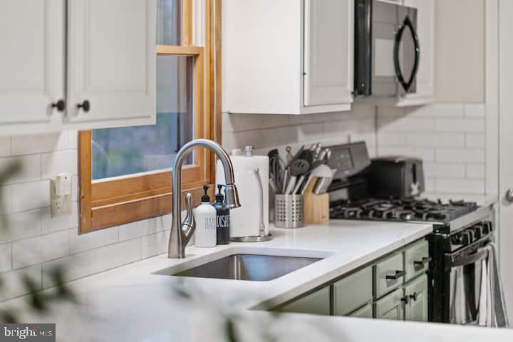 162 Forrest Street Basye, VA 22810 - Photo 15 of 41 a kitchen with stainless steel appliances granite countertop a sink and a stove