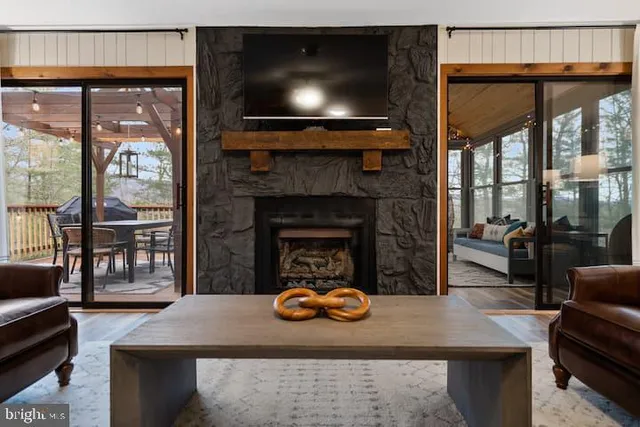 a living room with furniture and a fireplace