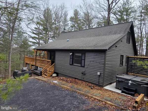 a view of a roof deck with wooden fence and floor