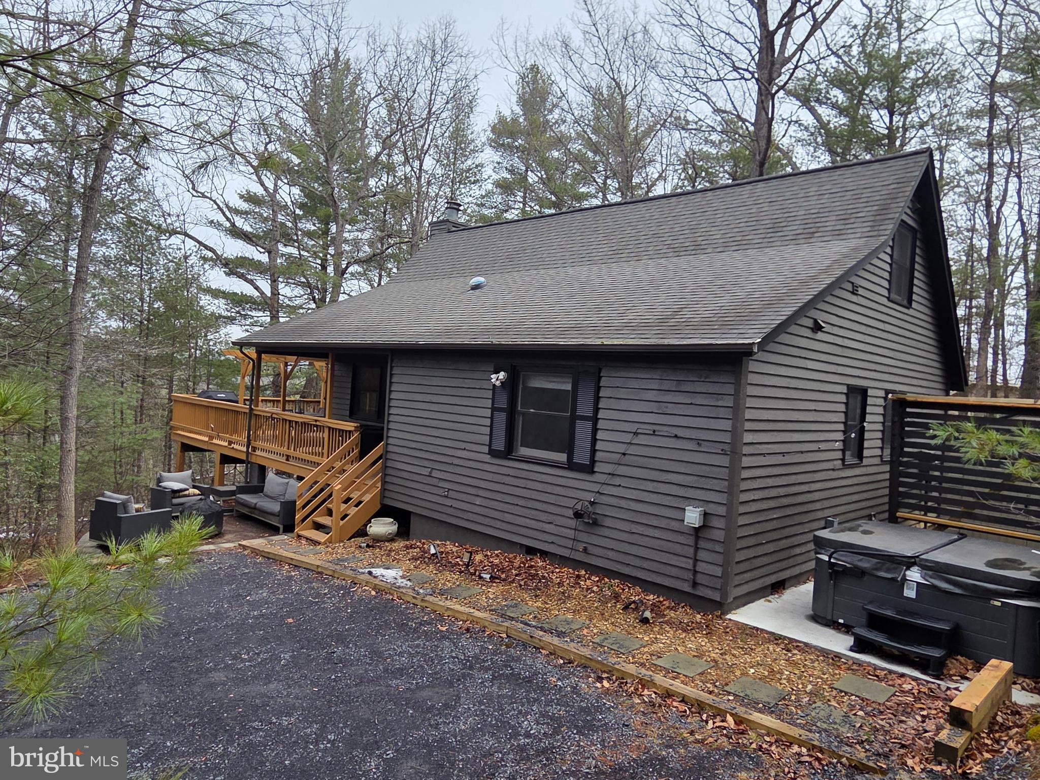 162 Forrest Street Basye, VA 22810 - Photo 47 of 50 a backyard of a house with barbeque oven and trees