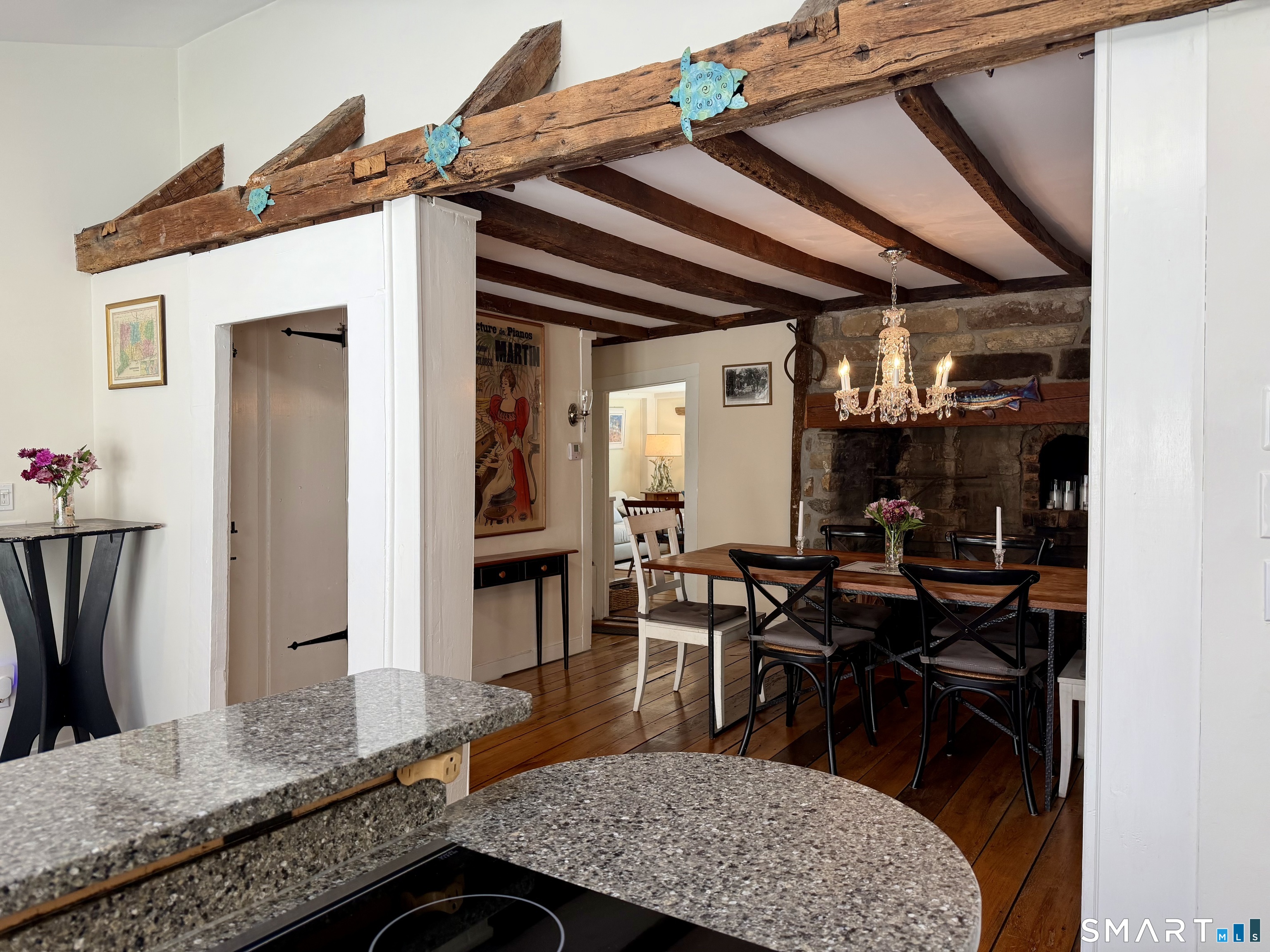 509 Boston Post Road Madison, CT 06443 - Photo 12 of 34 Views into the stunning Dining Room with original fireplace.