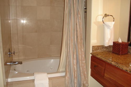 500 Village Road, Unit 206 217 Breckenridge, CO 80424 - Photo 15 of 20 a bathroom with a granite countertop sink and a mirror