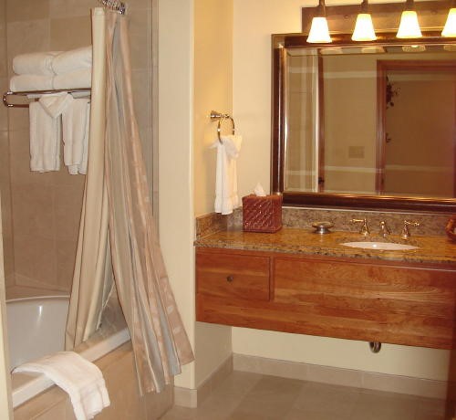 500 Village Road, Unit 206 217 Breckenridge, CO 80424 - Photo 16 of 20 a bathroom with a granite countertop sink and a mirror