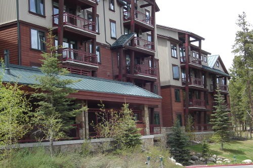 500 Village Road, Unit 206 217 Breckenridge, CO 80424 - Photo 20 of 20 a view of a brick building with many windows and a yard