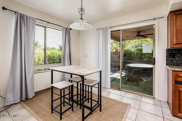 a view of a dining room with furniture window and outside view