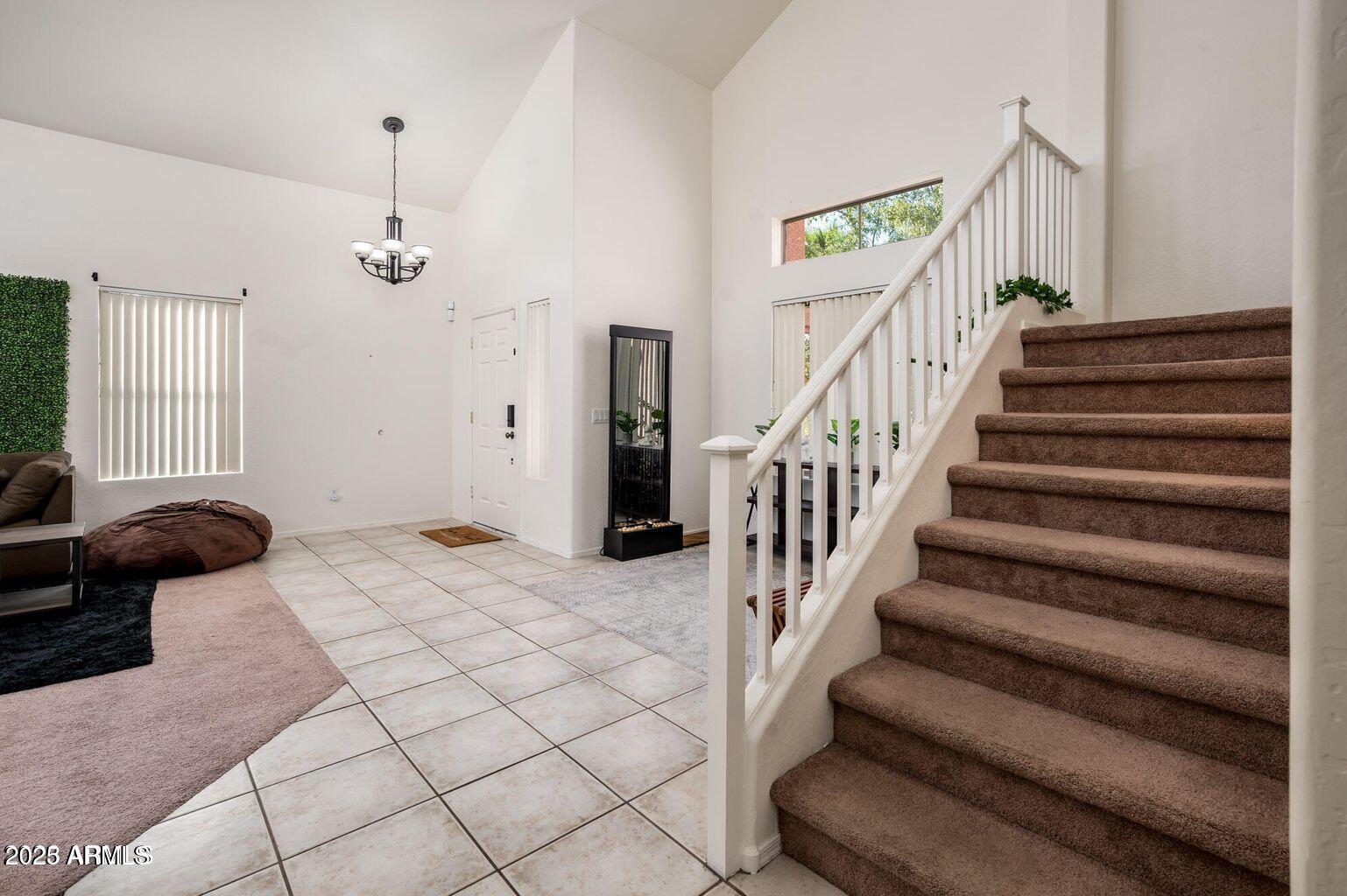 13604 West Rovey Avenue Litchfield Park, AZ 85340 - Photo 15 of 33 a view of entryway and hall with wooden floor