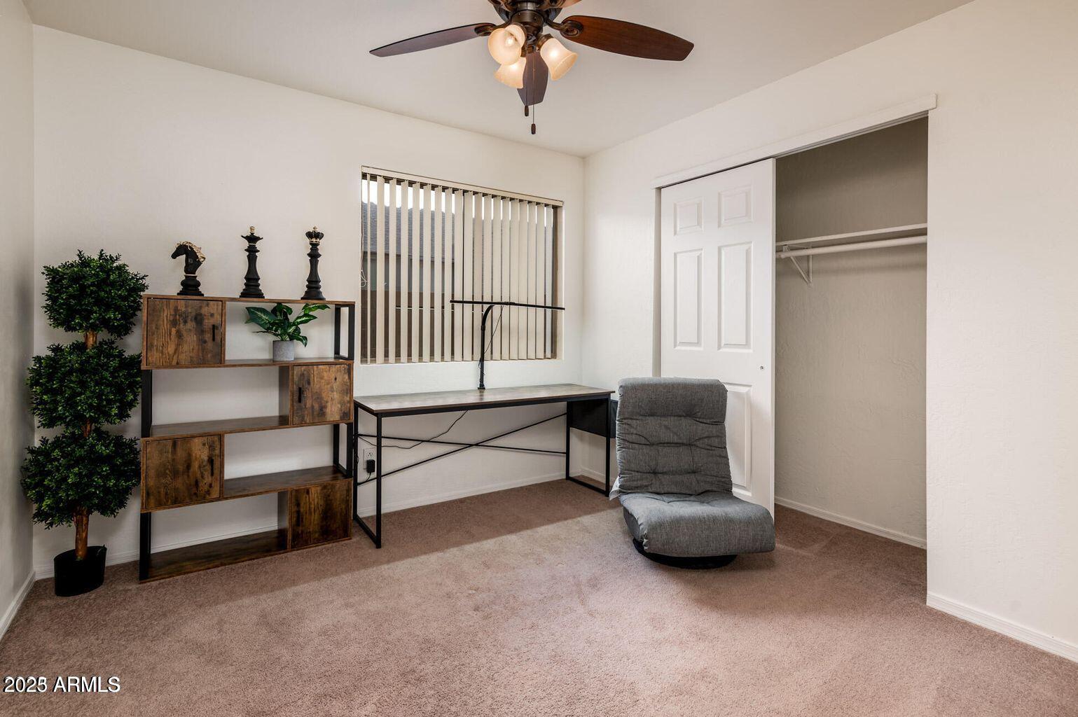 13604 West Rovey Avenue Litchfield Park, AZ 85340 - Photo 23 of 33 a living room with furniture and a window
