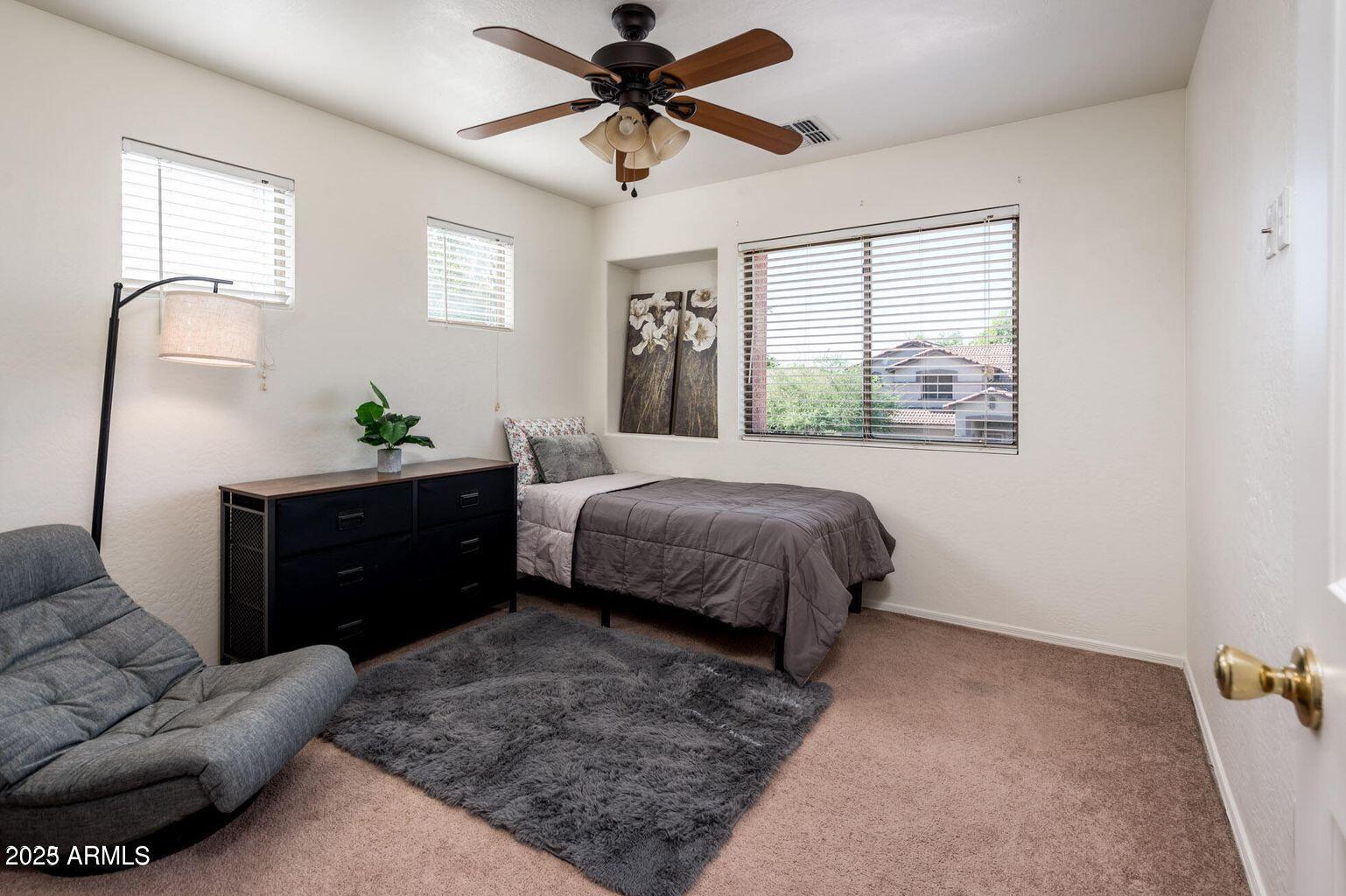 13604 West Rovey Avenue Litchfield Park, AZ 85340 - Photo 25 of 33 a bedroom with a bed and window