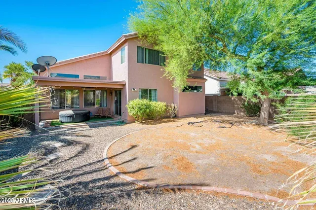 a view of a backyard of a house