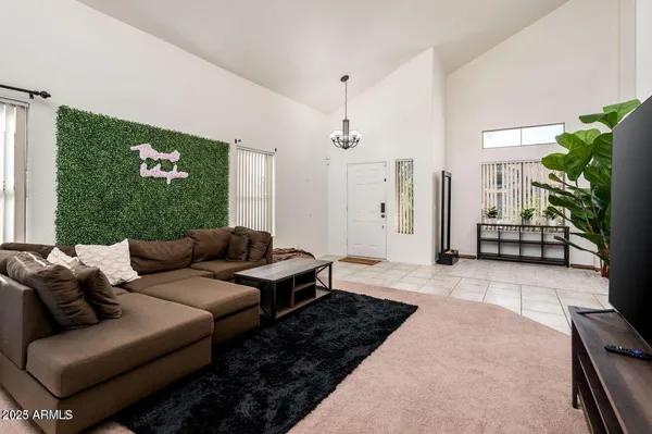 a living room with furniture rug and window