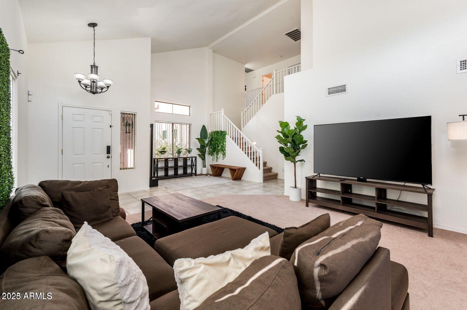 13604 West Rovey Avenue Litchfield Park, AZ 85340 - Photo 7 of 33 a living room with furniture and a flat screen tv
