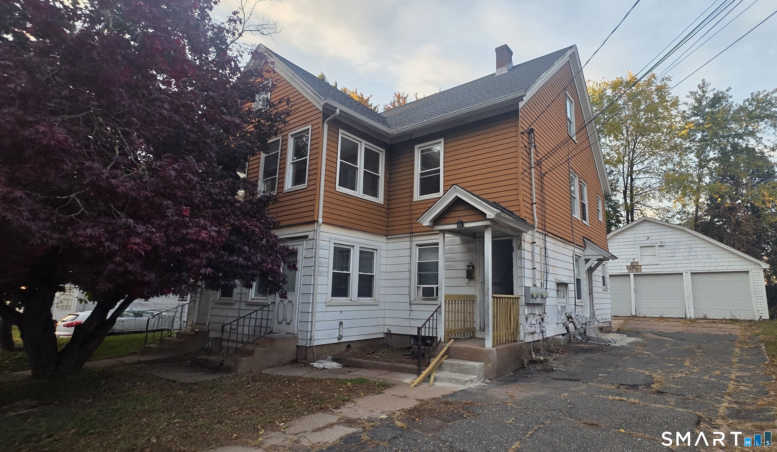 a front view of a house with a garage