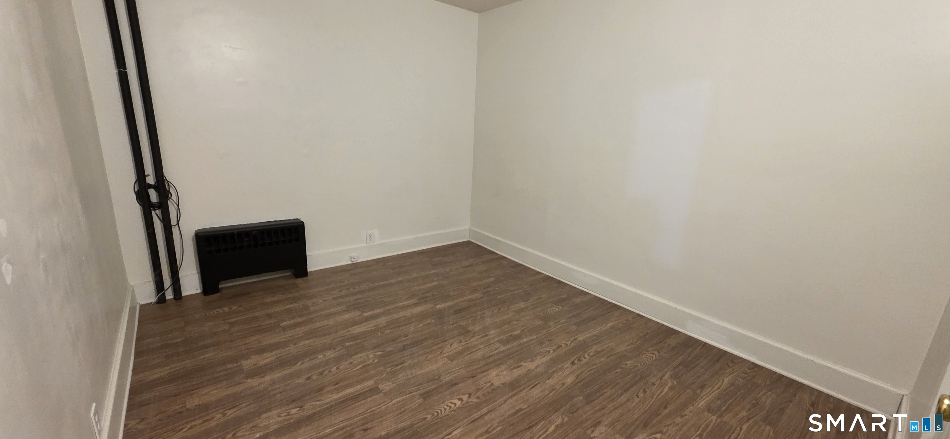 137 Birch Street, Unit 139 Manchester, CT 06040 - Photo 12 of 14 a view of empty room with wooden floor