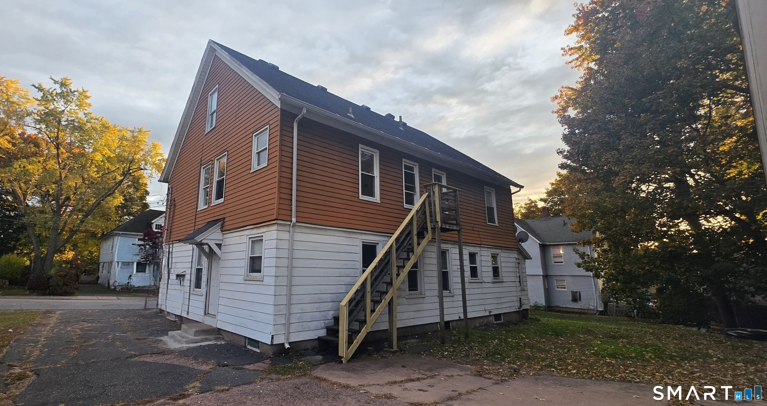 137 Birch Street, Unit 139 Manchester, CT 06040 - Photo 14 of 14 a view of a house with a yard