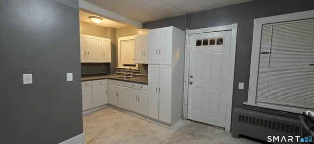 a kitchen with cabinets and a stove