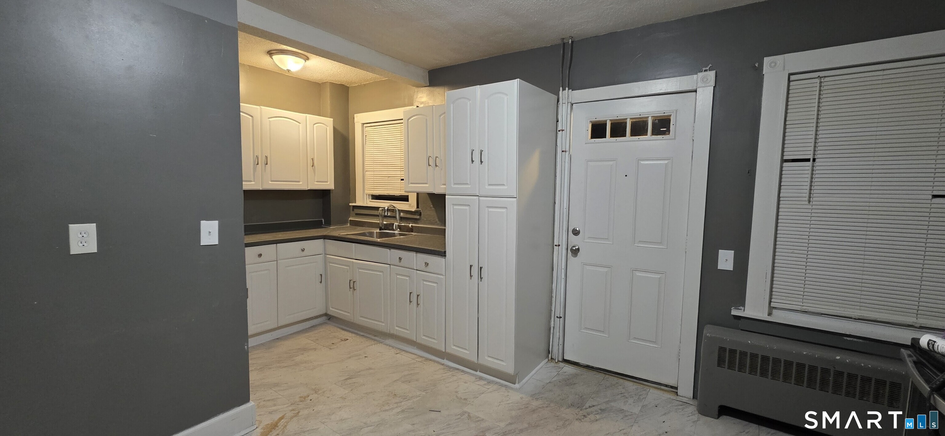 137 Birch Street, Unit 139 Manchester, CT 06040 - Photo 2 of 14 a kitchen with cabinets and a stove