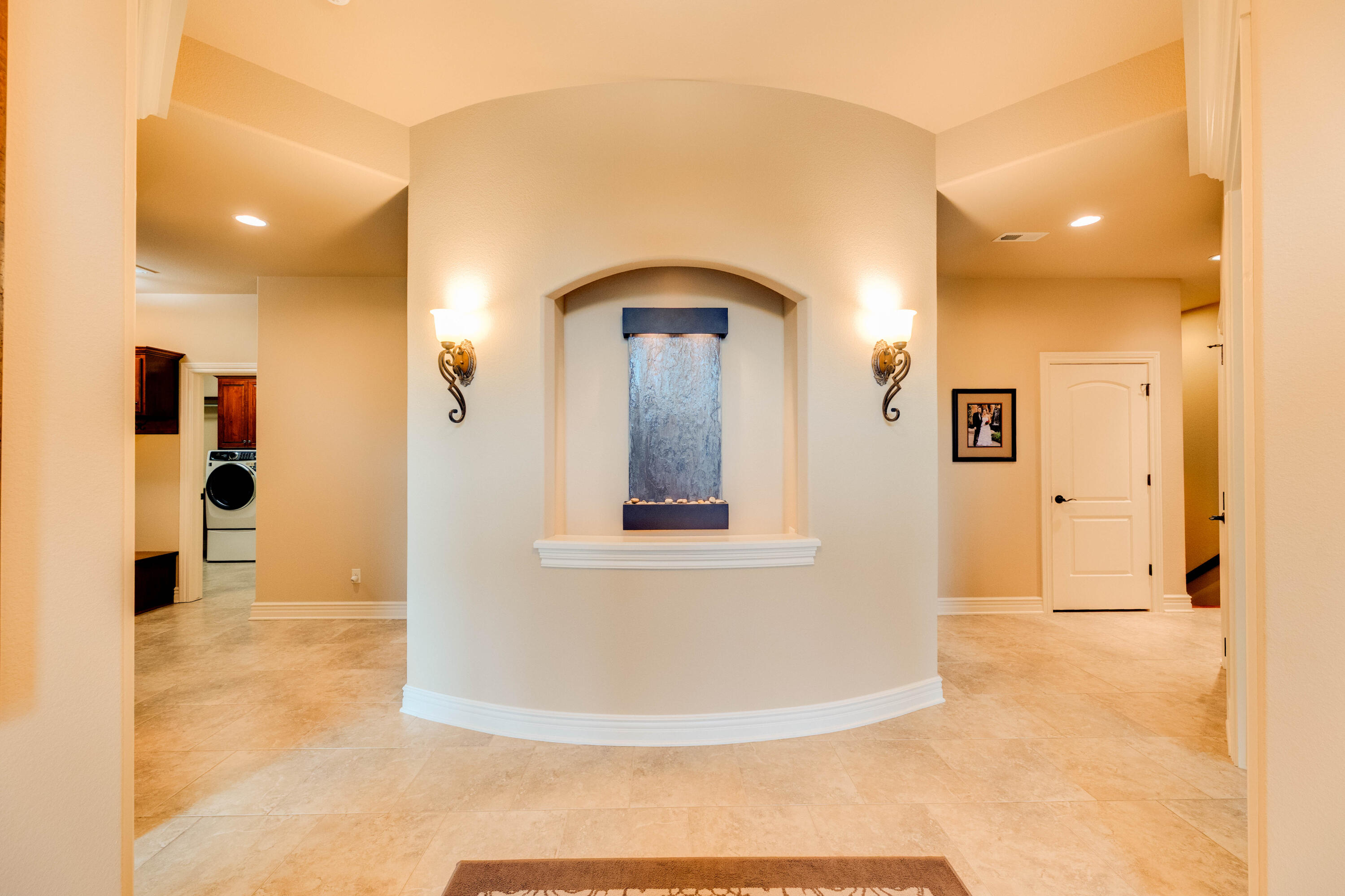 S63-w34455 Piper Road Eagle, WI 53119 - Photo 9 of 56 Foyer with tranquil waterfall