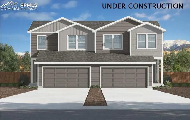 a front view of a house with a garage