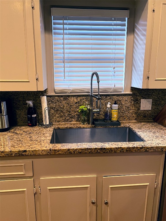 2106 Colquitt Street Houston, TX 77098 - Photo 14 of 31 a kitchen with granite countertop white cabinets and a sink