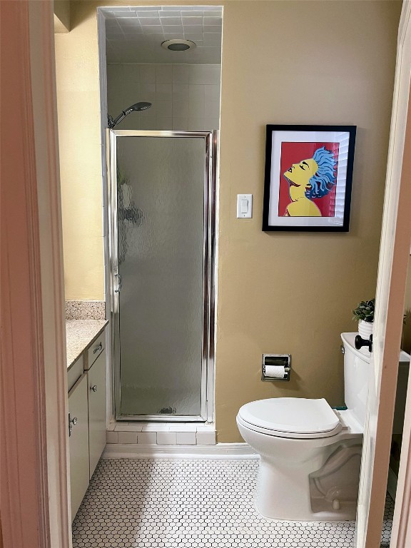 2106 Colquitt Street Houston, TX 77098 - Photo 25 of 31 a bathroom with a toilet and a shower