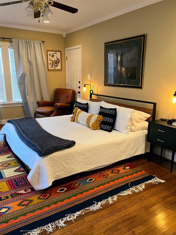 2106 Colquitt Street Houston, TX 77098 - Photo 26 of 31 a bedroom with bed and wooden floor