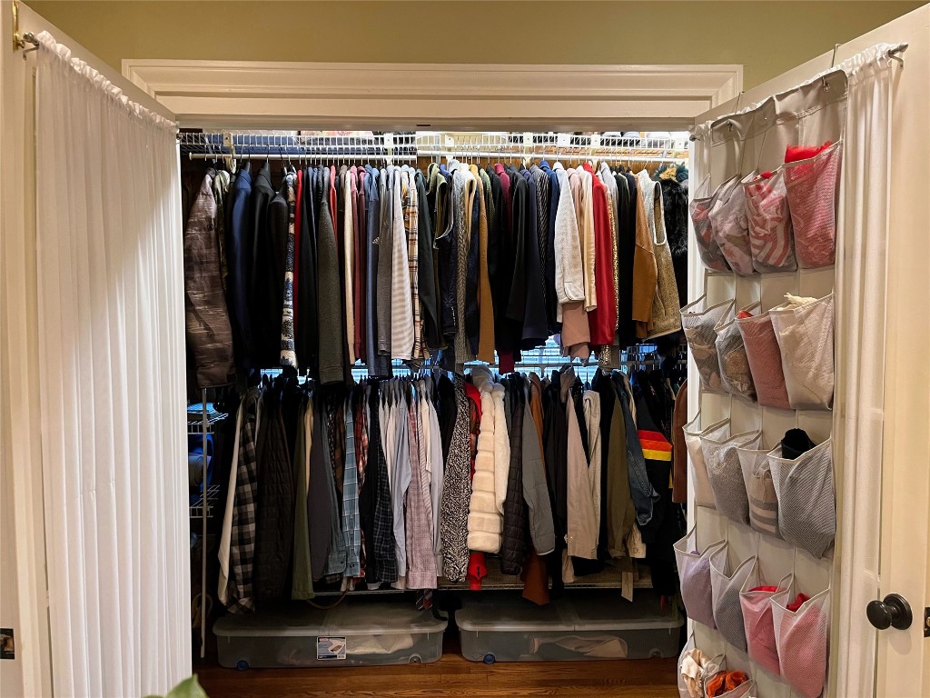 2106 Colquitt Street Houston, TX 77098 - Photo 27 of 31 a view of walk in closet with clothes