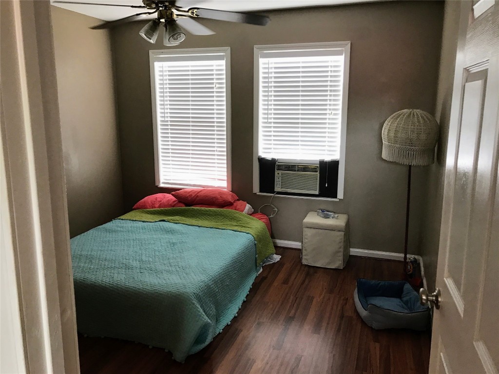 2106 Colquitt Street Houston, TX 77098 - Photo 30 of 31 a bedroom with a bed and a window