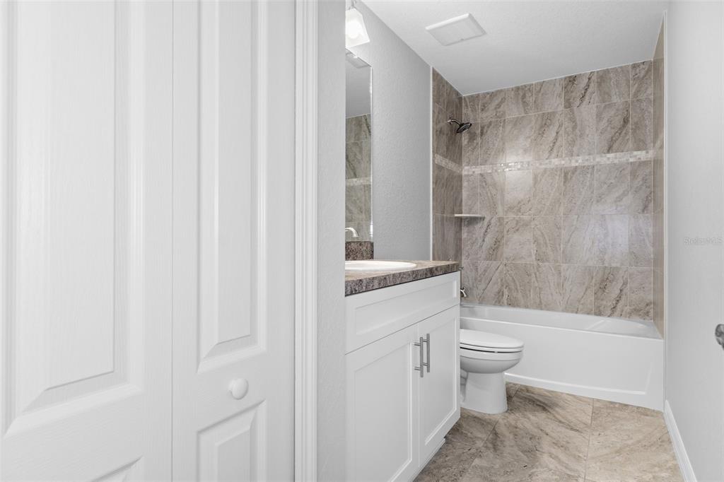 16375 Kakawi Road Brooksville, FL 34614 - Photo 23 of 30 a bathroom with a toilet a sink and a bathtub