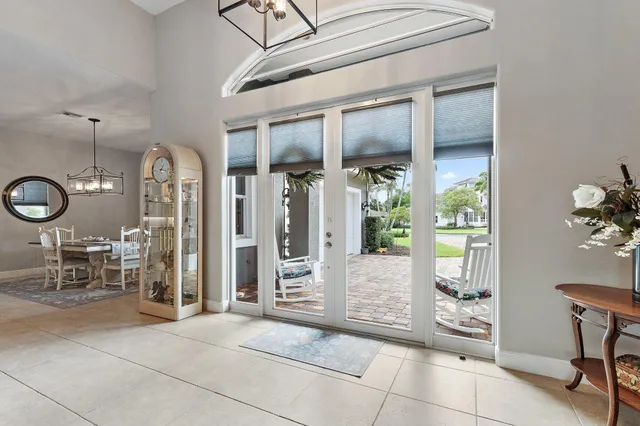 a living room with furniture pool table and a flat screen tv